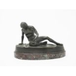 A bronze seated Figure of a naked gladiator with a wound to his chest on an oval marble base, 6 1/