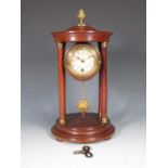 An Empire style portico Mantel Clock with gilt acorn finial, the circular dial decorated floral