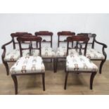 A set of six Regency mahogany Dining Chairs with shaped and scrolled top rails, stuff-over seats
