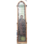 A late 19th Century coloured leaded glass church Window depicting St John in modern oak frame 11ft