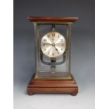 A Bulle Mantel Clock in glazed and mahogany Case on bun feet 10 1/2in H x 7in W