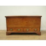 An 18th Century elm Mule Chest with hinged top above two drawers on bracket supports, 3ft 7in W