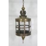 A 19th Century brass Hanging Lantern, the ball and crown finial above the glazed circular light with