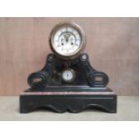 A Victorian black marble cased Mantle Clock with circular white enamel dial having visible anchor