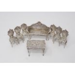 A Victorian Continental silver miniature Table, Settee and six Chairs, decorated figures, scroll,