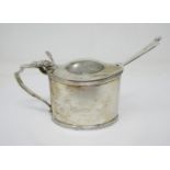 A George III silver oval Mustard Pot with hinged lid engraved crest, London 1796, hinge A/F and a