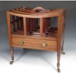 A 19th Century mahogany Canterbury with pierced carrying handle, four divisions, fitted drawer, on