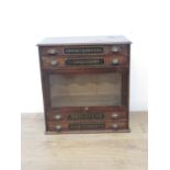 A Victorian Bagley & Wright's 'Brighteye' stained pine Haberdashery Display Cabinet fitted four