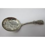 A Victorian silver Caddy Spoon with leafage engraved circular bowl, Birmingham 1838, maker: G.