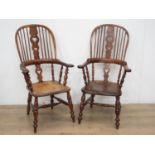 A near pair of early 19th Century elm and yew wood broad arm Windsor Chairs with pierced heart splat