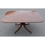 A Regency mahogany Breakfast Table with rounded rectangular top on turned column and quadruple