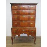 An 18th Century walnut Chest on Stand, the upper section with three short drawers over three long,