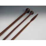Two Zulu long handled Throwing Clubs 4ft and 3ft 3in L and a Ceremonial wooden Spear 3ft 4in L