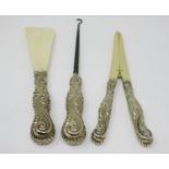 A Victorian silver-gilt handled Shoe Horn, Button Hook and Glove Stretchers with floral and scroll