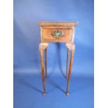 An 18th Century walnut Jardiniere Stand with feather banded and quarter veneered top, fitted