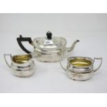 A George V silver bachelor's three piece Tea Set of brat shape with gadroon rims and engraved