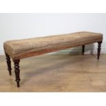 A Victorian mahogany Footstool on turned supports in need of re-upholstery 4ft 4in W x 1ft 4in H