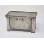A hammered pewter Arts and Crafts two division Tea Caddy in the form of a Black Mountain Coffer with