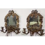 A pair of gilt metal Girandole Mirrors with twin sconces, ribbon surmount and the frame of flowers