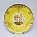 A Minton circular Bowl with fluted rim, the central panel painted cockerel and flowers, the sides