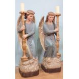 ****** WITHDRAWN ****** A pair of 19th Century painted plaster standing Candle Stands in the form
