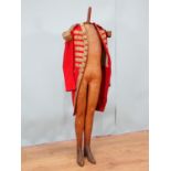 A late 18th or early 19th Century British Army type 'Red Coat' with brass button initialled 'M',