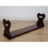 A 19th Century mahogany Book Trough with shaped folding ends mounted upon turned feet 2ft 4in W x