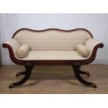 A Regency style Window Seat in the form of a scroll-end Settee with shaped back, scrolled arms and