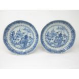 A pair of Chinese blue and white Dishes with pagoda landscapes 10in, both rivetted, and three