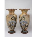 A pair of Royal Doulton Vases by Eliza Simmance with flared rims and decorated sprays of blue