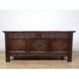 A 17th Century oak three panel Coffer with moulded lid above grape and thistle frieze and diamond