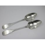 A pair of George III Irish silver Table Spoons, fiddle pattern engraved crests, rat tail bowls,