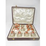 A Royal Crown Derby Coffee Set for six with Imari pattern, the cups with silver holders,