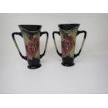 A small pair of Moorcroft two handled Vases with hibiscus type floral design, dated 2008, 6in H