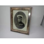 A Geo V silver Photograph frame with pierced gallery edge, containing a signed photograph of