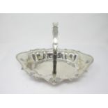An Edward VII silver shaped oval Cake Basket with swing handle, London 1906, 550gms
