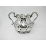 A Victorian silver large two-handled Bowl with floral and scroll decoration, engraved crest,