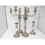 A pair of Sheffield plated two-branch, three-light Candelabrum and a pair of plated Candlesticks