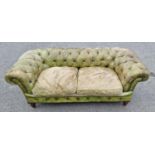 A green leather button upholstered Chesterfield Settee on turned tapering supports, (reupholstered