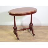 A Victorian mahogany oval Occasional Table mounted upon turned cheval supports and leafage carved