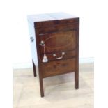 A Georgian mahogany enclosed Washstand with folding top fitted cupboard and drawer on squared