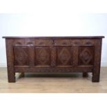 A 17th Century oak four panel Coffer with lunette carved frieze and interlocking design on stile