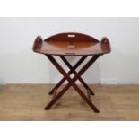 A 19th Century mahogany Butler's Tray on stand, the tray having four folding sides with pierced