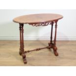 A Victorian walnut oval Occasional Table mounted upon twisted and tuned double end supports united