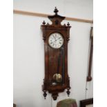 A 19th Century Vienna Wall Clock with circular dial, single weight driven movement in glazed case