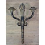 A two branch Wall Light with flame finial, the scrolled arms with mythical head finials, 1ft 10in H