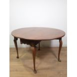 A George II Irish walnut oval dropleaf Dining Table mounted upon cabriole supports and snake feet