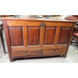 An 18th Century oak Mule Chest with plain 2-panel lid above four plain fielded panel front above two