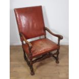 A 19th Century carved Elbow Chair with leather upholstered back and seat, acanthus leaf carving to