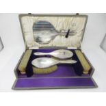 A George V silver mounted five-piece Dressing Table Set with engine turning and initial B, London